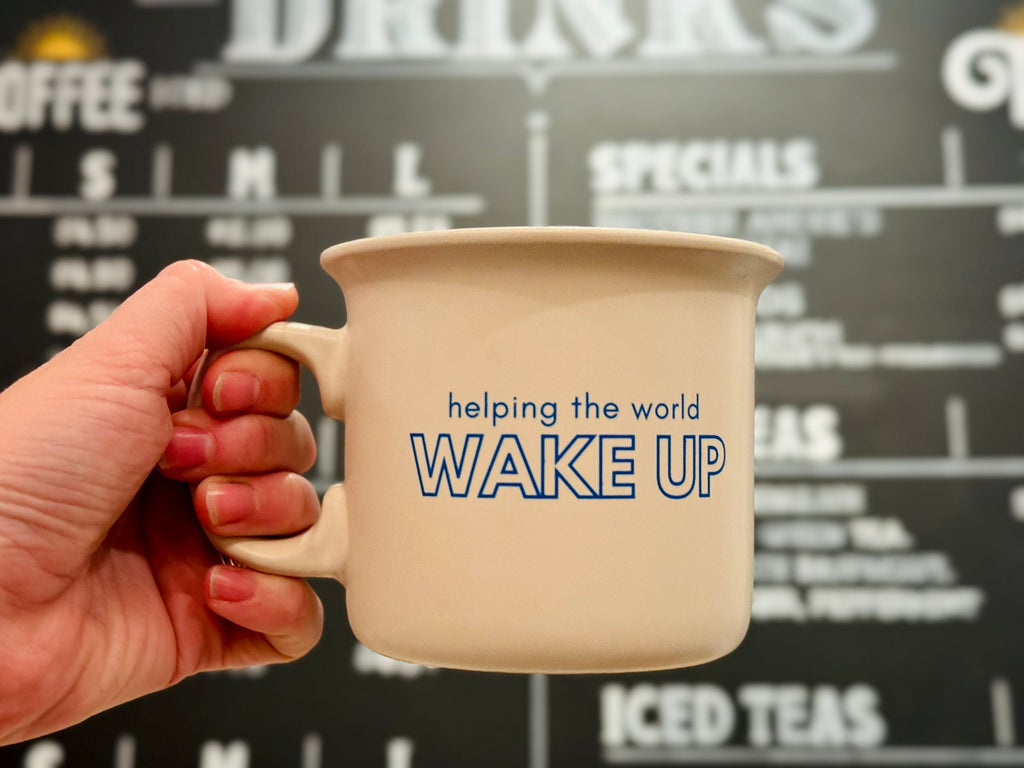Classic ceramic diner-style mug in cream featuring Brother Andre's Cafe blue logo